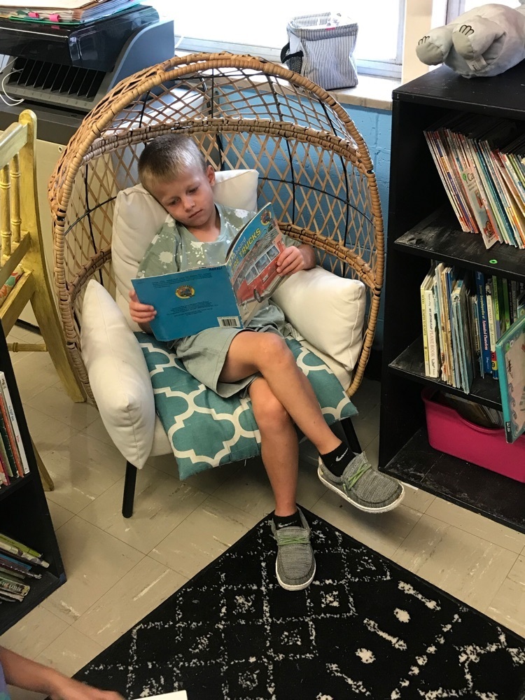 Enjoying a comfy spot in our reading center!