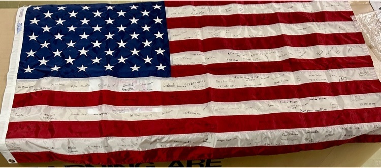 Eric Winkle brought this flag, signed by Westside students and staff in 2003 and sent to him while he served in Iraq.